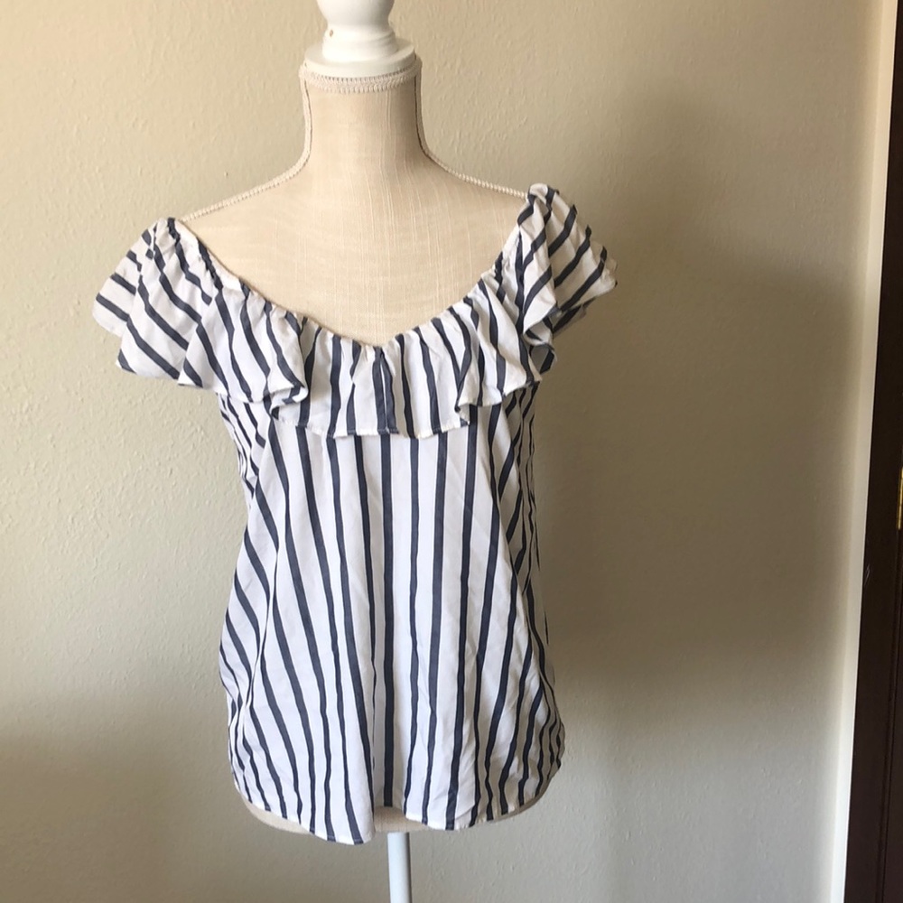 Cute blue and white stripe blouse, with ruffle detail on top.